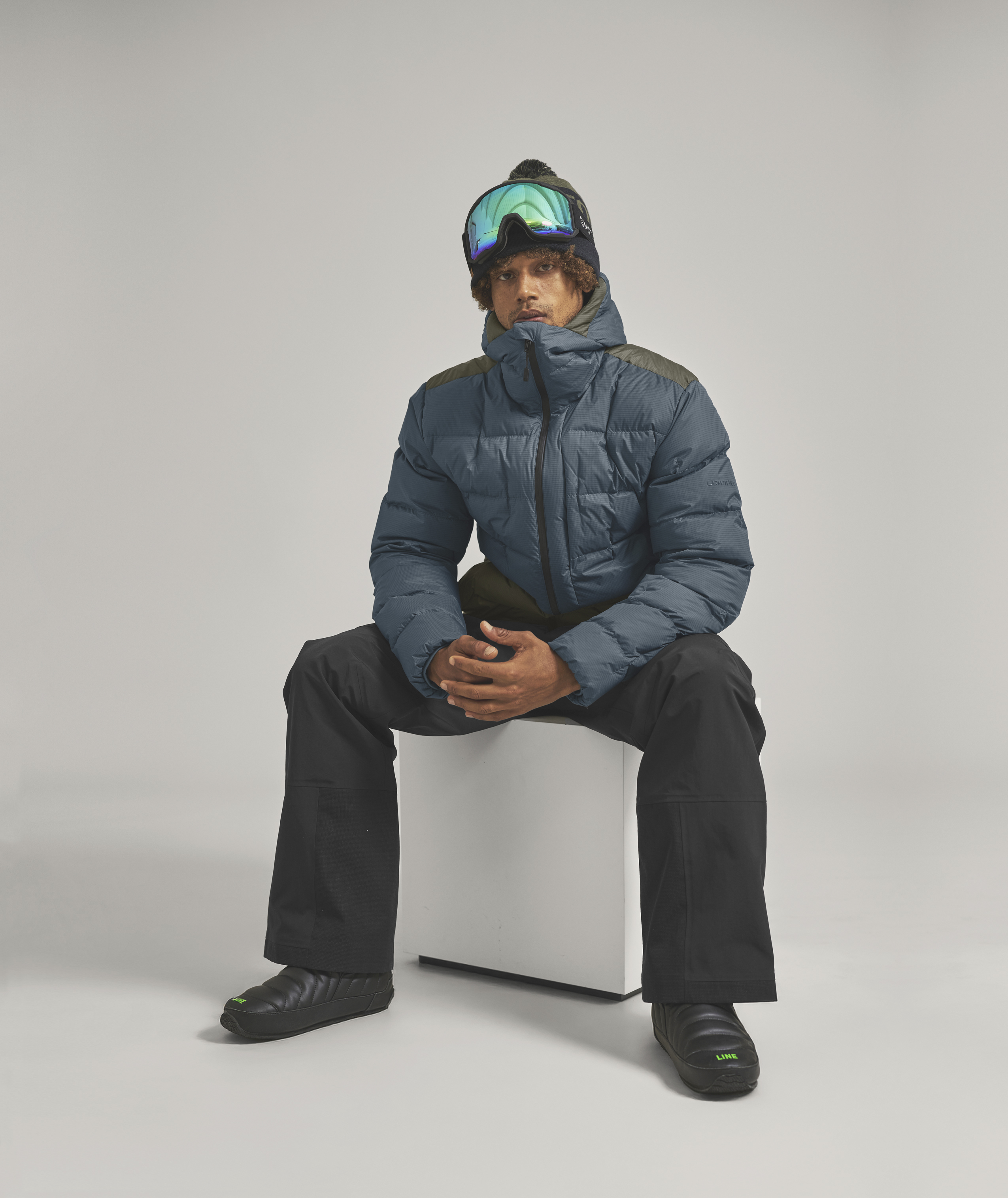 Coat, Jacket, Person, Sitting, Pants, Coat, Jacket, Person, Sitting, Pants