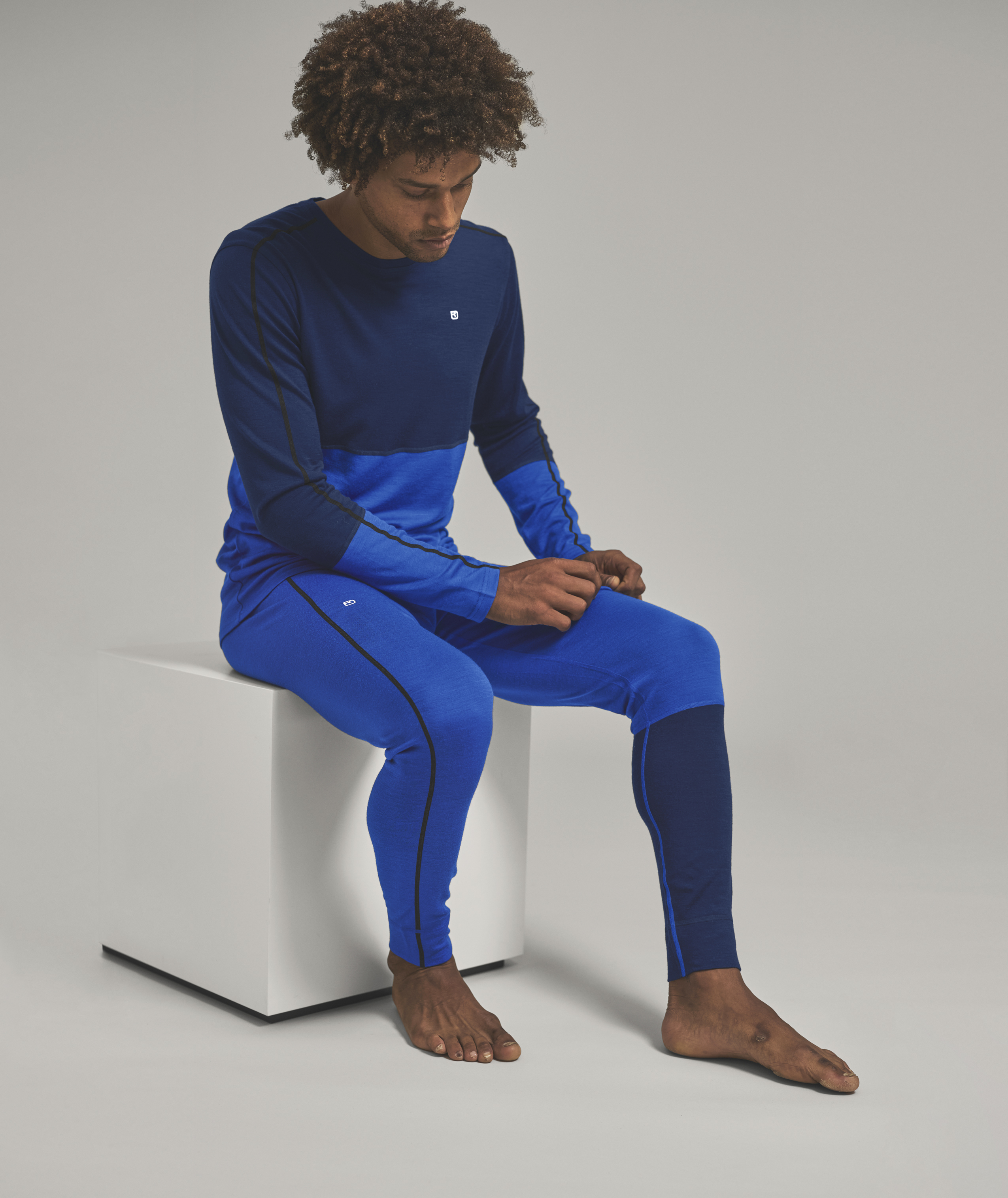 Person, Sitting, Long Sleeve, Pants, Pajamas, Person, Sitting, Long Sleeve, Pants, Pajamas