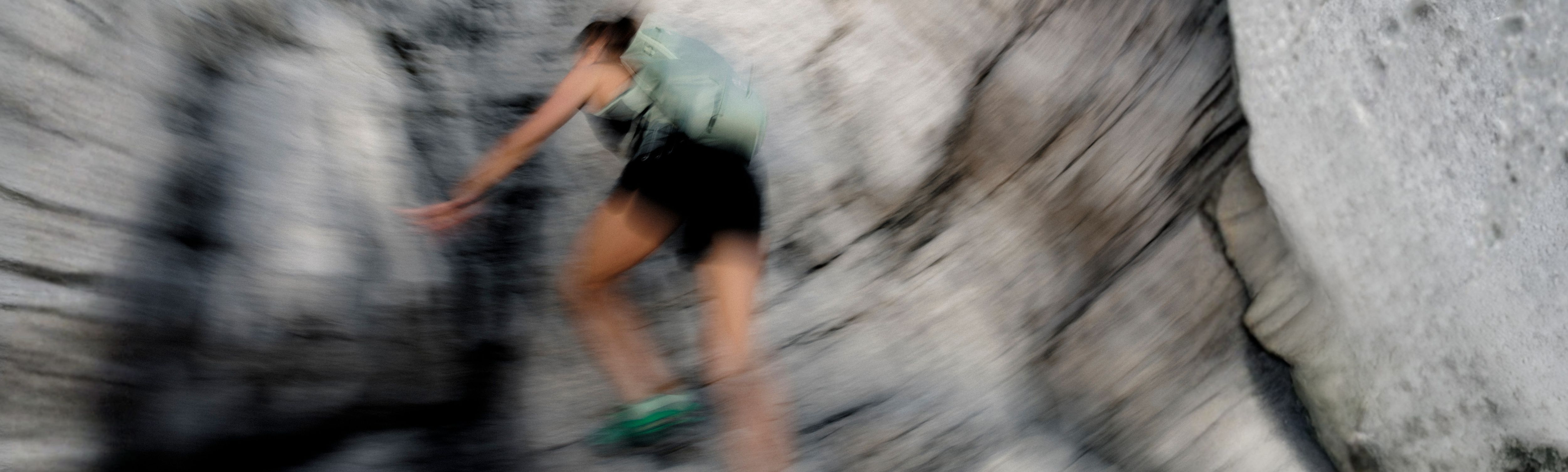 hiker, backpack, tanktop, shorts, green-shoes